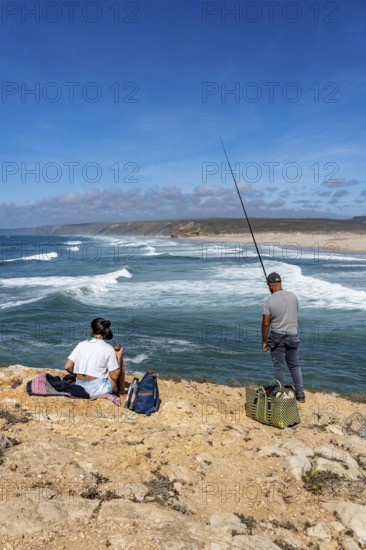 Anglers on the cliffs at the viewpoint above Praia da Bordeira beach, near Carrapateira, popular with surfers, surfers, rocky coast, cliffs in the south-west of the Algarve, Portugal