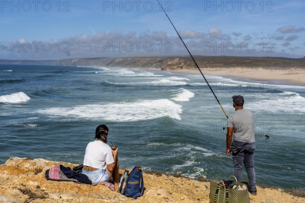 Anglers on the cliffs at the viewpoint above Praia da Bordeira beach, near Carrapateira, popular with surfers, surfers, rocky coast, cliffs in the south-west of the Algarve, Portugal