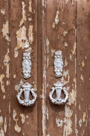 The old town centre of Tavira, typical door knockers found on many wooden doors in the town, Algarve, Portugal