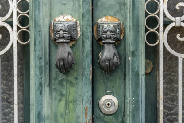 The old town centre of Tavira, typical door knockers found on many wooden doors in the town, Algarve, Portugal