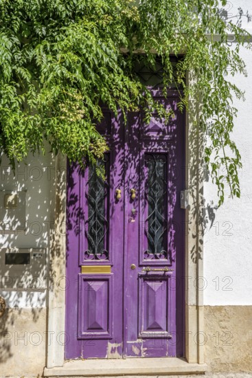 The old town centre of Tavira, typical door knockers found on many wooden doors in the town, Algarve, Portugal
