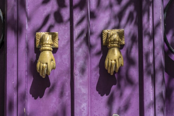 The old town centre of Tavira, typical door knockers found on many wooden doors in the town, Algarve, Portugal