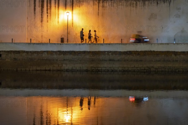 Evening in the old town centre, by the Gilao River, Tavira, in the Algarve, Portugal