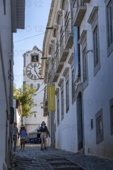 Old town alleys, catholic church Igreja de Santa Maria do Castelo in Tavira, in the Algarve, Portugal