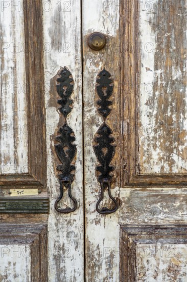 The old town centre of Tavira, typical door knockers found on many wooden doors in the town, Algarve, Portugal