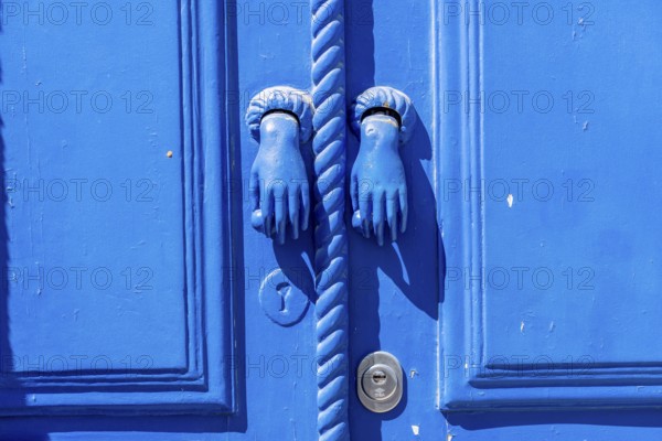 The old town centre of Tavira, typical door knockers found on many wooden doors in the town, Algarve, Portugal
