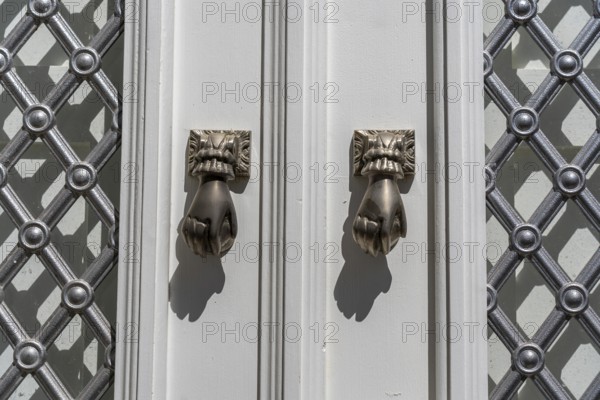 The old town centre of Tavira, typical door knockers found on many wooden doors in the town, Algarve, Portugal