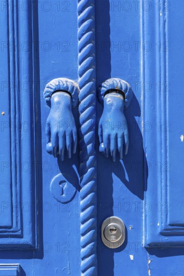 The old town centre of Tavira, typical door knockers found on many wooden doors in the town, Algarve, Portugal