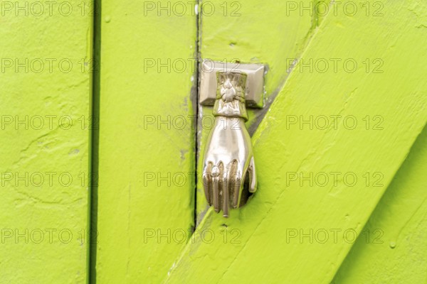 The old town centre of Tavira, typical door knockers found on many wooden doors in the town, Algarve, Portugal