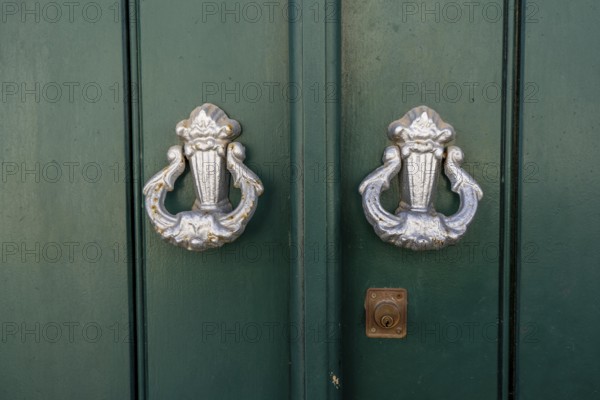 The old town centre of Tavira, typical door knockers found on many wooden doors in the town, Algarve, Portugal
