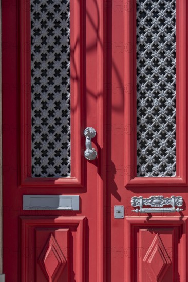 The old town centre of Tavira, typical door knockers found on many wooden doors in the town, Algarve, Portugal