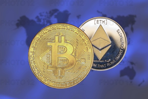 (Photomontage) Cryptocurrencies: Symbolic Bitcoin and Ethereum, cropped in front of a world map