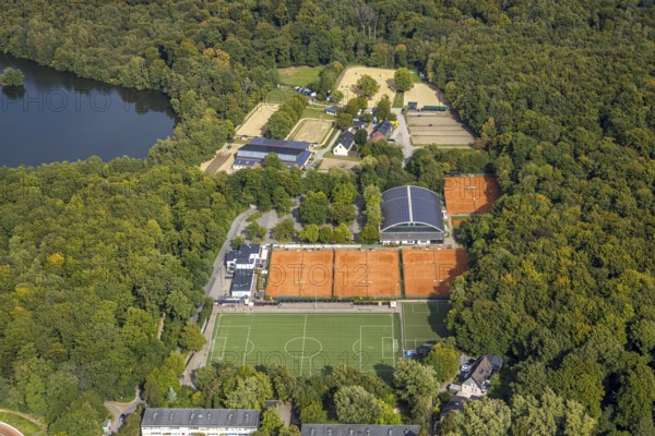 Aerial view, football stadium at the outdoor swimming pool TV Jahn Hiesfeld, Rotbachsee in the forest, tennis courts and facility Reitverein und Fahrverein 1946 e.V., Hiesfeld, Dinslaken, Ruhr area, North Rhine-Westphalia, Germany, DE, Europe, Hanseatic city, aerial view, aerial photography, aerial photography, Lower Rhine, equestrian sports, riding facility, riding centre, equestrian sports, equestrian sports facility, riding club, sports, tennis, tennis facility, tennis court, tennis courts, tennis club, overview, bird's-eye view, overview