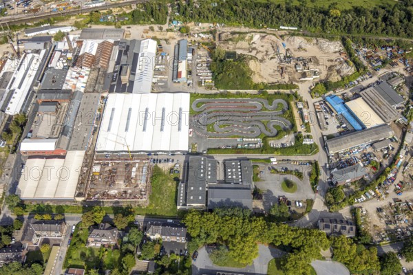 Aerial view, Thyssenstraße industrial estate with construction site, go-kart track, Averbruch, Dinslaken, Ruhr area, North Rhine-Westphalia, Germany, construction work, construction area, building site, building plots, construction project, construction site, DE, Europe, commercial enterprise, commercial area, commercial area, commercial property, commercial site, commercial use, go-kart track, go-karting, Hanseatic city, industrial area, industrial site, aerial view, aerial photography, aerial photography, new construction, Lower Rhine, racetrack, overview, bird's-eye view, overview
