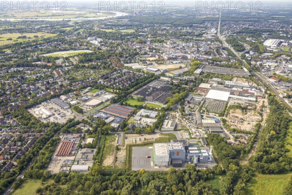 Aerial view, industrial area Thyssenstraße with Dinslakener Holz-Energiezentrum DHE, in the background former MCS Technologies GmbH factory premises, on the left Drei Eichen and housing estate at Zedernweg and Avegunst, Averbruch, Dinslaken, Ruhr area, North Rhine-Westphalia, Germany, DE, energy plant, energy supplier, energy industry, Europe, commercial enterprise, commercial space, commercial area, commercial property, commercial location, commercial use, Hanseatic city, industrial area, industrial location, aerial view, aerial photography, aerial photography, Lower Rhine, overview, bird's eye view, birds-eyes view, overview
