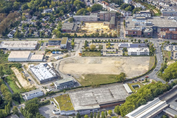 Aerial view, Hamco construction site at the corner of Hans-Böckler-Straße and Otto-Brenner-Straße, behind Dinslaken Vocational College with construction site for new school complex, Dinslaken, Ruhr area, North Rhine-Westphalia, Germany, construction work, construction area, building site, building plots, construction, construction project, construction site, vocational school, education, educational institution, DE, Europe, Hanseatic city, educational institute, aerial view, aerial photography, aerial photography, new building, Lower Rhine, school, overview, bird's eye view, birds-eyes view, overview