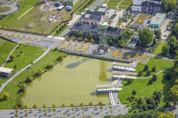 Aerial view, Bergpark Lohberg Kreativquartier, former colliery site and landscaping, Lohberger Weiher with water tower and shadows, Oberlohberg, Dinslaken, Ruhr area, North Rhine-Westphalia, Germany, DE, Europe, Hanseatic city, creative quarter, aerial view, aerial photography, aerial photography, Lower Rhine, tower, overview, bird's eye view, colliery, birds-eyes view, former colliery, overview