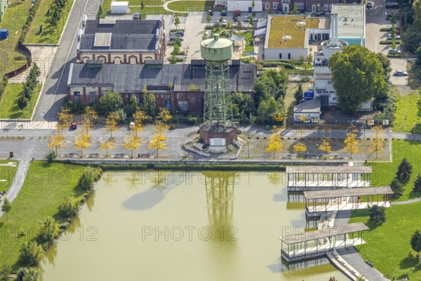 Aerial view, Bergpark Lohberg Kreativquartier, former colliery site and landscaping, Lohberger Weiher with water tower and shadows, Oberlohberg, Dinslaken, Ruhr area, North Rhine-Westphalia, Germany, DE, Europe, Hanseatic city, creative quarter, aerial view, aerial photography, aerial photography, Lower Rhine, tower, overview, bird's eye view, colliery, birds-eyes view, former colliery, overview