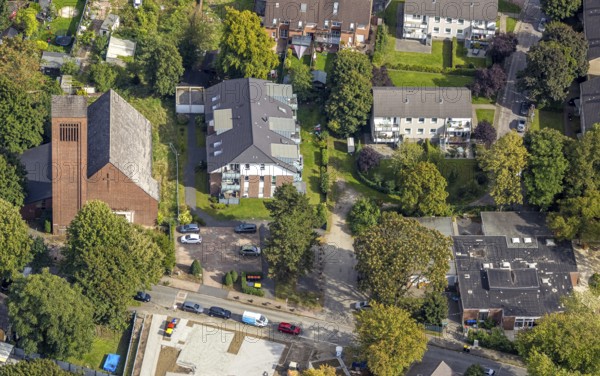 Aerial view, Lutherkirche am Martin-Luther-Platz und evang. Kindergarten Kita Lohberg, Lohberg, Dinslaken, Ruhr area, North Rhine-Westphalia, Germany, place of worship, DE, Europe, religious community, place of worship, Hanseatic city, holy place, kindergarten, day care centre, day care centre, church, parish, day care centre, denomination, aerial view, aerial photography, aerial photography, Lower Rhine, religion, religious site, overview, bird's-eye view, birds-eyes view, overview