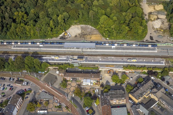 Aerial view, railway station Hbf with new platform and station forecourt, construction site extension and noise barrier, Betuweroute and Betuwe line extension of the railway line, Dinslaken, North Rhine-Westphalia, Germany, railway area, railway tracks, station, station forecourt, railway line, platform, construction work, construction area, construction site, building site, construction project, construction project, construction site, DE, Deutsche Bahn AG, Europe, railway tracks, tracks, Hanseatic city, central station, main station, aerial view, aerial photography, aerial photography, new construction, Lower Rhine, renovation, Ruhr area, redevelopment, overview, bird's-eye view, overview