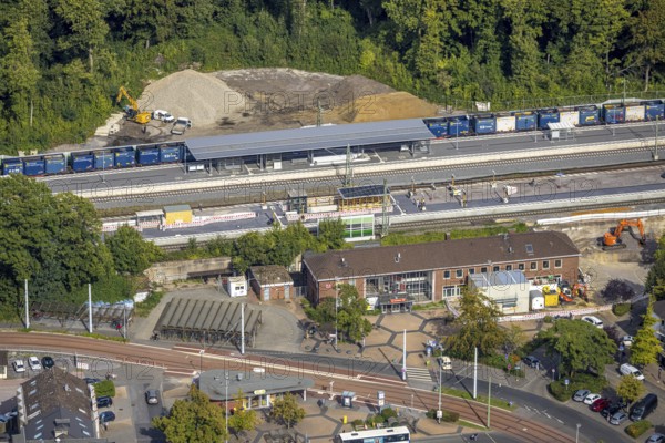 Aerial view, railway station Hbf with new platform and station forecourt, construction site extension and noise barrier, Betuweroute and Betuwe line extension of the railway line, Dinslaken, North Rhine-Westphalia, Germany, railway area, railway tracks, station, station forecourt, railway line, platform, construction work, construction area, construction site, building site, construction project, construction project, construction site, DE, Deutsche Bahn AG, Europe, railway tracks, tracks, Hanseatic city, central station, main station, aerial view, aerial photography, aerial photography, new construction, Lower Rhine, renovation, Ruhr area, redevelopment, overview, bird's-eye view, overview
