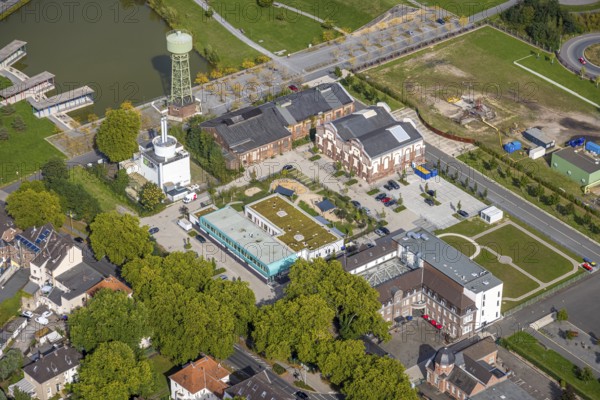 Aerial view, Bergpark Lohberg Kreativquartier, former colliery site and landscaping, Lohberger Weiher with water tower and shadows, Oberlohberg, Dinslaken, Ruhr area, North Rhine-Westphalia, Germany, DE, Europe, Hanseatic city, creative quarter, aerial view, aerial photography, aerial photography, Lower Rhine, tower, overview, bird's eye view, colliery, birds-eyes view, former colliery, overview