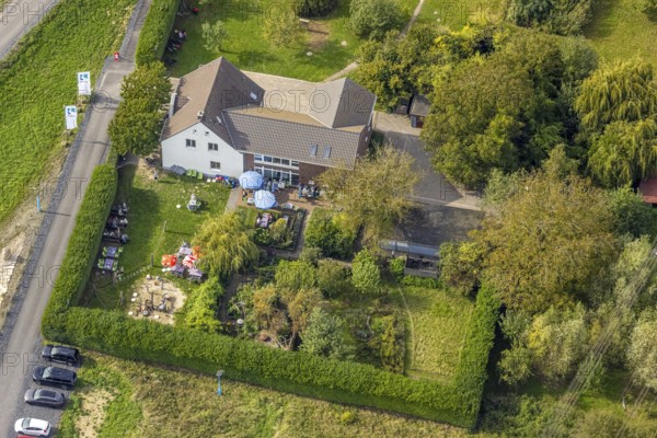 Aerial view, Hof Emschermündung Cafe and Gastronomy, street Am Hagelkreuz am Fluss Emcher, children's playground, Eppinghoven, Dinslaken, Ruhr area, North Rhine-Westphalia, Germany, outdoor catering, beer garden, café, DE, food and drink, Europe, inn, gastronomy, Hanseatic city, aerial view, aerial photography, aerial photography, Lower Rhine, restaurant, parasols, playground, overview, bird's eye view, birds-eyes view, overview