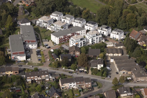 Aerial view, new multi-generational housing estate Högemannshof, single-family houses and apartment blocks, Malteserstift St. Barbara, Hünxe, Ruhr area, North Rhine-Westphalia, Germany, DE, single-family houses, development, Europe, building, community, green spaces, houses, real estate, infrastructure, landscape, aerial view, aerial photography, aerial photography, multi-family houses, multi-generation housing estate, neighbourhood, new construction, Lower Rhine, care facility, settlement, urban planning, streets, overview, bird's-eye view, residential area, residential building, birds-eyes view, modern housing, overview, overview