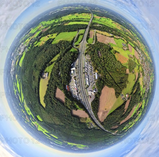 Aerial view, service area Hünxe-Ost and Hünxe-West, petrol station and rest area with truck parking on the A3 motorway and Hünxe junction, meadows and fields with forest area, globe, fisheye image, fisheye image, 360 degree image, tiny world, little planet, fisheye image, Hünxe, Ruhr area, North Rhine-Westphalia, Germany, DE, Europe, fisheye lens, fisheye lens, truck stop, Little Planet, aerial photography, aerial photography, aerial photography, Lower Rhine, road traffic, super wide angle lens, Tiny World, overview, bird's eye view, forest area, globe, birds-eyes view, fisheye lens, insta360 camera, overview