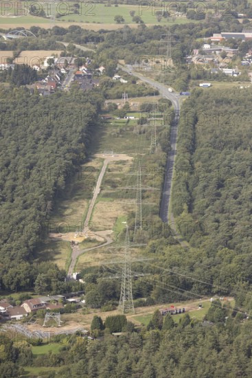 Aerial photo, work on the transmission grid, extra-high-voltage power line, power pylon extension for power line in the Speller Heide forest on Hans-Richter-Straße, Friedrichsfeld, Voerde, Ruhr area, North Rhine-Westphalia, Germany, DE, energy plant, Europe, Hünxe, aerial photo, aerial photography, aerial photography, Lower Rhine, power supply, overview, bird's-eye view, overview