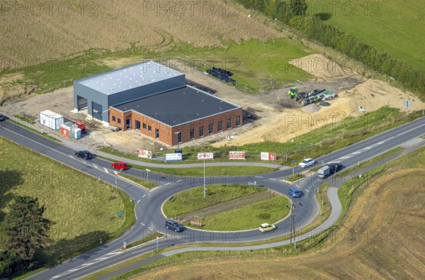 Aerial view, construction site new development area with roundabout Hammweg and Grenzstraße, Voerde, Ruhr area, North Rhine-Westphalia, Germany, construction work, construction area, building site, building plots, construction project, construction site, DE, Europe, roundabout, aerial view, aerial photography, aerial photography, new construction, Lower Rhine, road traffic, overview, Voerde (Lower Rhine), bird's eye view, birds-eyes view, overview