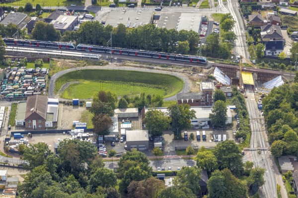 Aerial view, S-Bahn and railway line across Spellener Straße, bridge construction and extension of the Betuweroute and Betuwe-Line railway line, Friedrichsfeld, Voerde, Ruhr area, North Rhine-Westphalia, Germany, railway area, DE, Deutsche Bahn AG, Europe, track systems, tracks, aerial view, aerial photography, aerial photography, Lower Rhine, overview, Voerde (Lower Rhine), bird's-eye view, bird's-eye view, overview