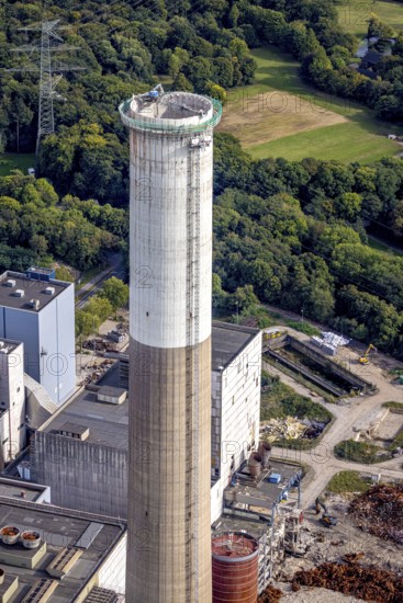 Aerial view, construction site with dismantling work on a tower of the Voerde power plant, Möllen, Voerde, Ruhr area, North Rhine-Westphalia, Germany, demolition work, excavator, construction work, construction site, building site, construction project, construction site, DE, Europe, aerial view, aerial photography, aerial photography, Lower Rhine, dismantling, overview, Voerde (Lower Rhine), bird's eye view, bird's eye view, overview