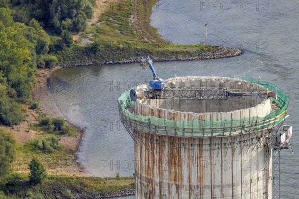Aerial view, construction site with dismantling work on a tower of the Voerde power plant, Möllen, Voerde, Ruhr area, North Rhine-Westphalia, Germany, demolition work, excavator, construction work, construction site, building site, construction project, construction site, DE, Europe, aerial view, aerial photography, aerial photography, Lower Rhine, dismantling, overview, Voerde (Lower Rhine), bird's eye view, bird's eye view, overview