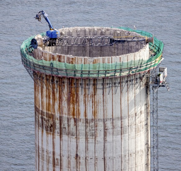 Aerial view, construction site with dismantling work on a tower of the Voerde power plant, Möllen, Voerde, Ruhr area, North Rhine-Westphalia, Germany, demolition work, excavator, construction work, construction site, building site, construction project, construction site, DE, Europe, aerial view, aerial photography, aerial photography, Lower Rhine, dismantling, overview, Voerde (Lower Rhine), bird's eye view, bird's eye view, overview