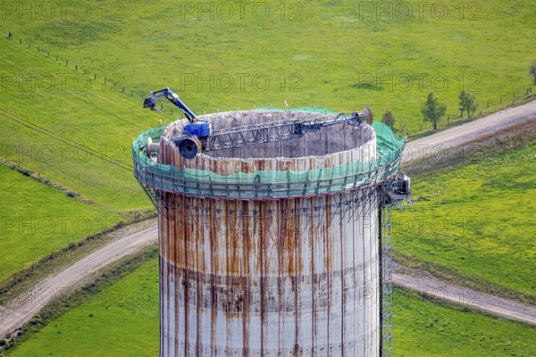 Aerial view, construction site with dismantling work on a tower of the Voerde power plant, Möllen, Voerde, Ruhr area, North Rhine-Westphalia, Germany, demolition work, excavator, construction work, construction site, building site, construction project, construction site, DE, Europe, aerial view, aerial photography, aerial photography, Lower Rhine, dismantling, overview, Voerde (Lower Rhine), bird's eye view, bird's eye view, overview