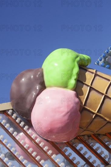 Ice cream cone with colourful ice cream scoops as decoration at the Bremer Osterwiese folk festival, Bürgerweide, Bremen, Germany