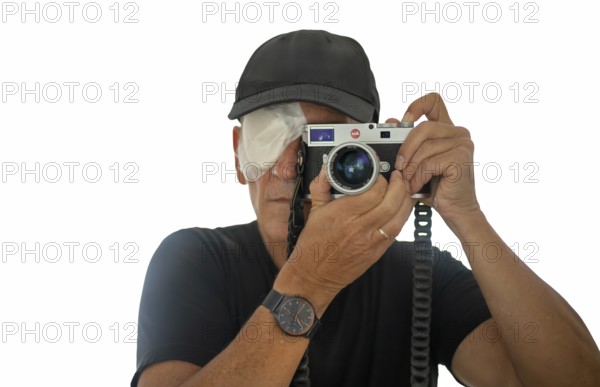 Portrait, self-portrait, selfie, photographer with eye bandage, eye injury, bandage on eye, looking through camera, viewfinder camera, photographed, Leica M11, Stuttgart, Baden-Württemberg, Germany