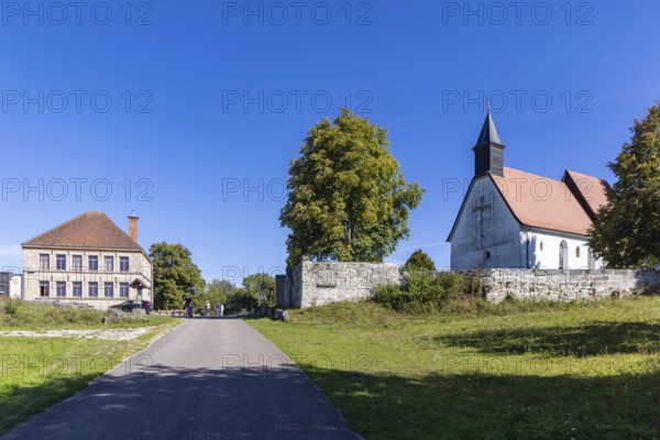 Gruorn is a deserted village near Münsingen in the Swabian Alb. The former village is located in the former military training area and has been part of the newly established Swabian Alb biosphere reserve since 2008. Landscape with St Stephen's Church and the preserved schoolhouse. Münsingen, Baden-Württemberg, Germany