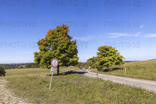 Hikers in the Swabian Alb biosphere reserve. The former military training area in Münsingen is an important part of this area. Signpost Danger to life from unexploded ordnance. The protected area is an 85, 270-hectare biosphere reserve of the state of Baden-Württemberg. The area has been a UNESCO biosphere reserve since May 2009. Münsingen, Baden-Württemberg, Germany