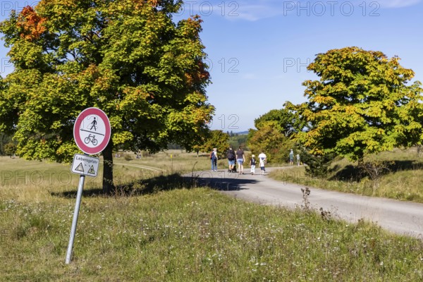 Hikers in the Swabian Alb biosphere reserve. The former military training area in Münsingen is an important part of this area. Signpost Danger to life from unexploded ordnance. The protected area is an 85, 270-hectare biosphere reserve of the state of Baden-Württemberg. The area has been a UNESCO biosphere reserve since May 2009. Münsingen, Baden-Württemberg, Germany