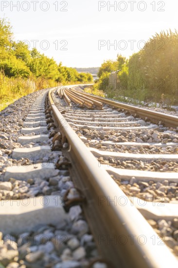 Railway tracks in a sunny and green environment, Hermann Hessebahn construction site, Calw, Germany