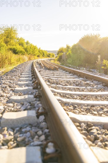 Tracks run in a curve through a picturesque landscape, Hermann Hessebahn construction site, Calw, Germany