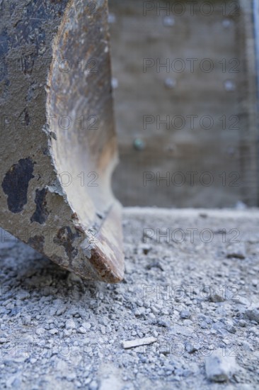 Close-up of a worn shovel on ballast in a construction site environment, Hermann Hessebahn construction site, Calw, Germany