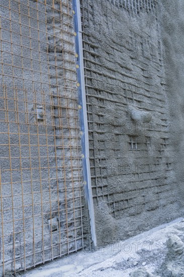 Close-up of a concrete wall with visible wire mesh on a construction site, Hermann Hessebahn construction site, Calw, Germany