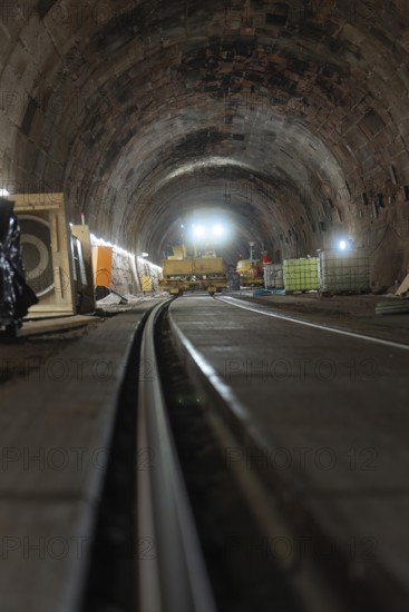 Rail construction in the tunnel with machines and equipment placed on the sides, construction of the Hermann Hesse railway, Calw, Black Forest, Germany