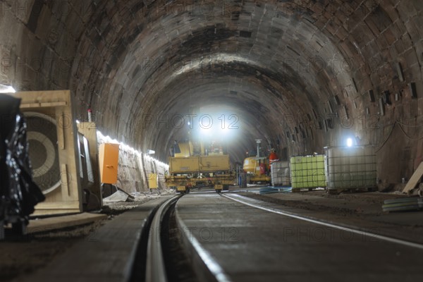 Construction work in the tunnel with machines and lighting along the tracks, construction of the Hermann Hesse railway, Calw, Black Forest, Germany