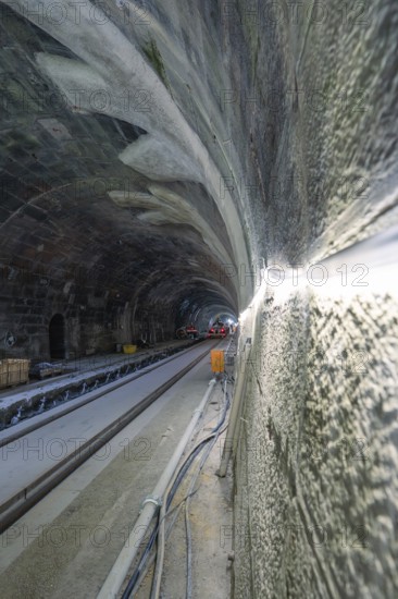 Unfinished tunnelling with exposed cables and rails in a shady environment, construction of the Hermann Hessebahn, Calw, Black Forest, Germany