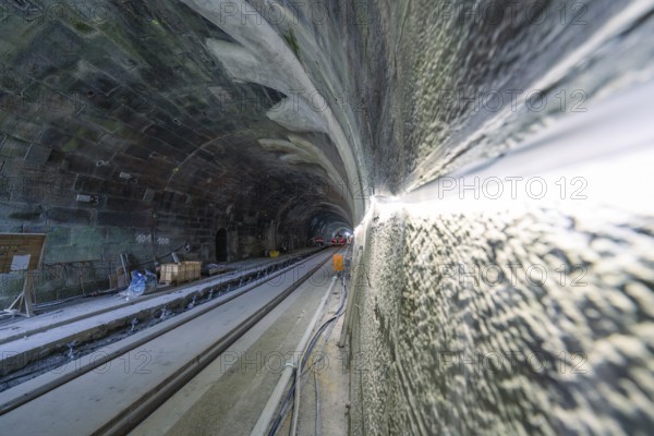 Close-up on the wall of an illuminated tunnel in a dynamic perspective, construction of the Hermann Hesse railway, Calw, Black Forest, Germany