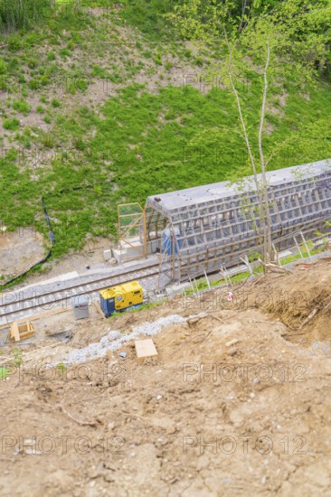 Construction site along the tracks on a hill, showing progress of the work and surrounding vegetation, construction of the Hermann Hesse railway, Calw, Black Forest, Germany